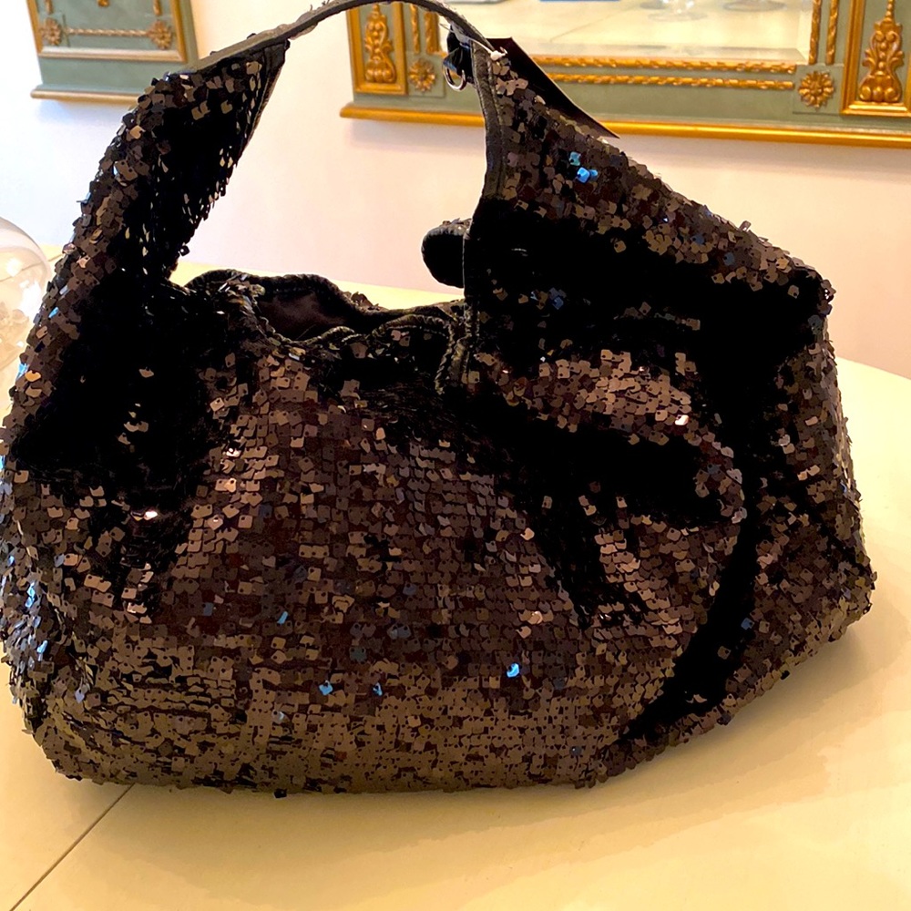 Black sequined overnight/travel bag. Roomy, never used with snap enclosure.